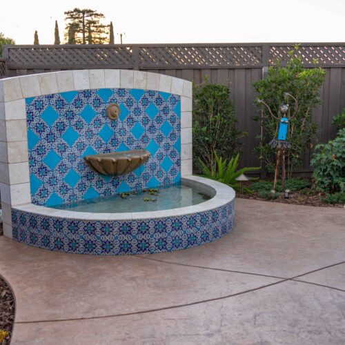 Custom designed Talavera tiled Fountain with a Travertine tile frame and pond cap