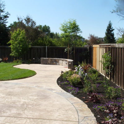 Stamped concrete bordered in natural flagstone