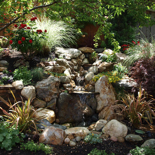 Natural stone waterfall on slope