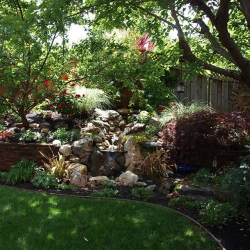 Natural stone waterfall on slope