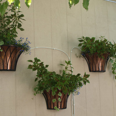 Half round copper and iron planters